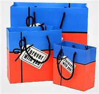 广州厂家,专业定制,供应纸袋,韩版时尚拼色英文字母礼品袋,蝴蝶结手提袋