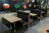 大学生食堂采用板式卡座沙发和钢木桌椅组合